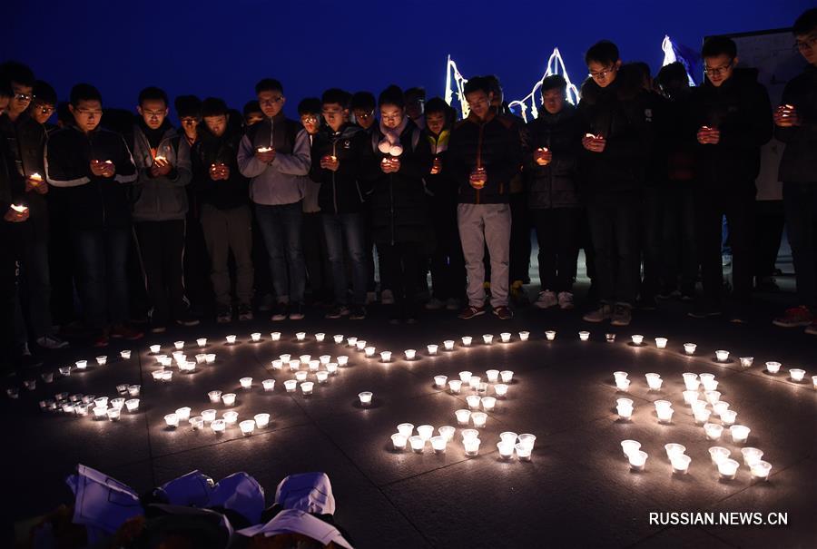 Студенты провели панихиду со свечами в память об убитых в Нанкинской резне 1937 года